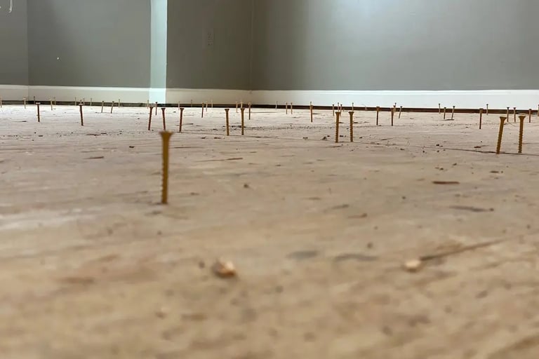 re-screwing subfloor.