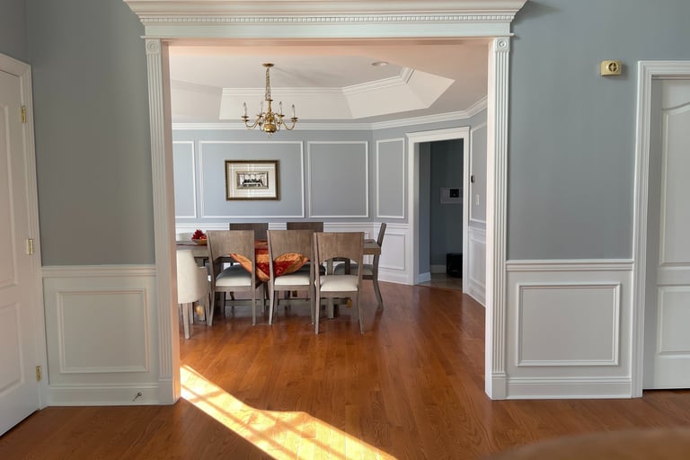Custom wainscoting, wall frames, and decorative trim in a Monmouth County dining room