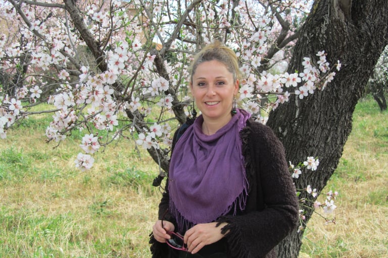 a woman in a purple scarf around her neck