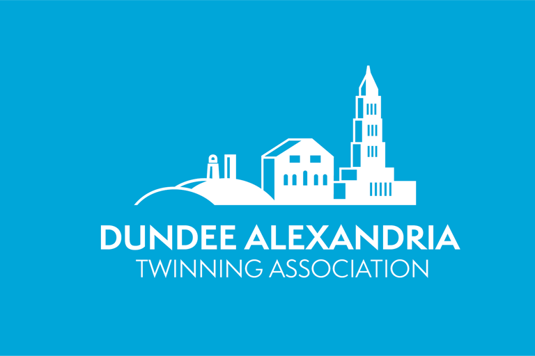 Dundee Alexandria Twinning Association logo featuring a white cityscape silhouette on a blue background.