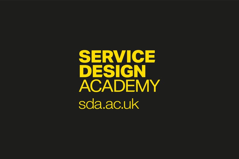 The Service Design Academy logo with a yellow sans-serif font on a dark background, and the website sda.ac.uk.