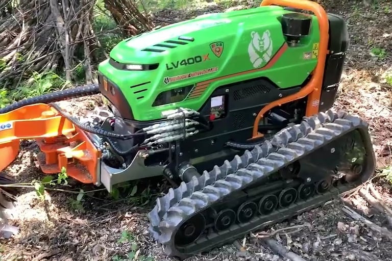 Green Climber LV 400 X Model in forested area with attachment doing work