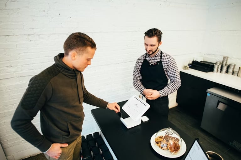 Tablet screen with financial charts and bar graphs, showing the growth of online auto parts and filter sales