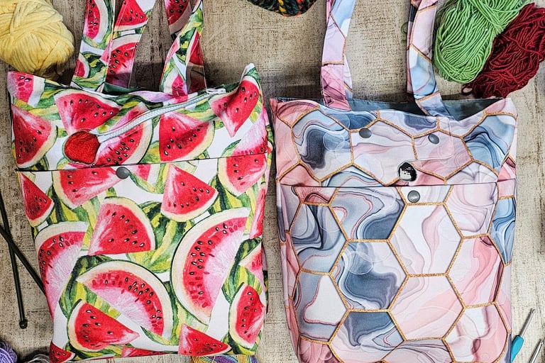 a photo of two colorful bags laying between yarn