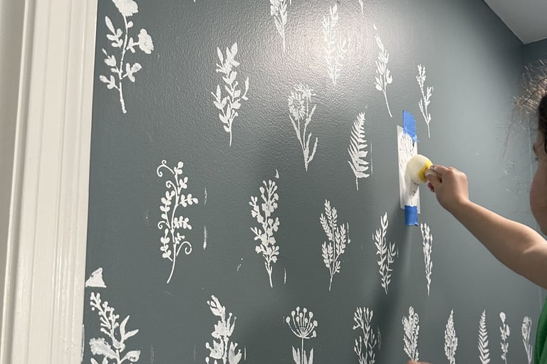 Kid helping with home DIY project: Wall Stenciling