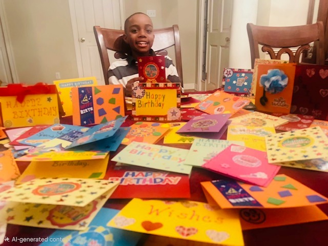 Truman pictured with birthday cards he created for clients of MIFA's Meals on Wheels program.