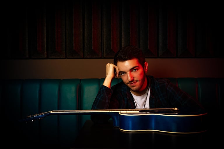 a man with a guitar and a guitar