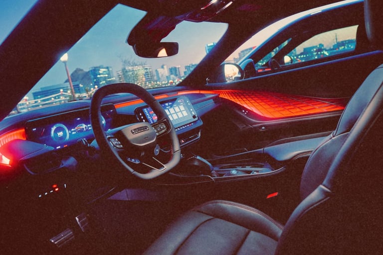 Modern luxury car interior featuring red ambient lighting, digital dashboard, and leather seats at night.