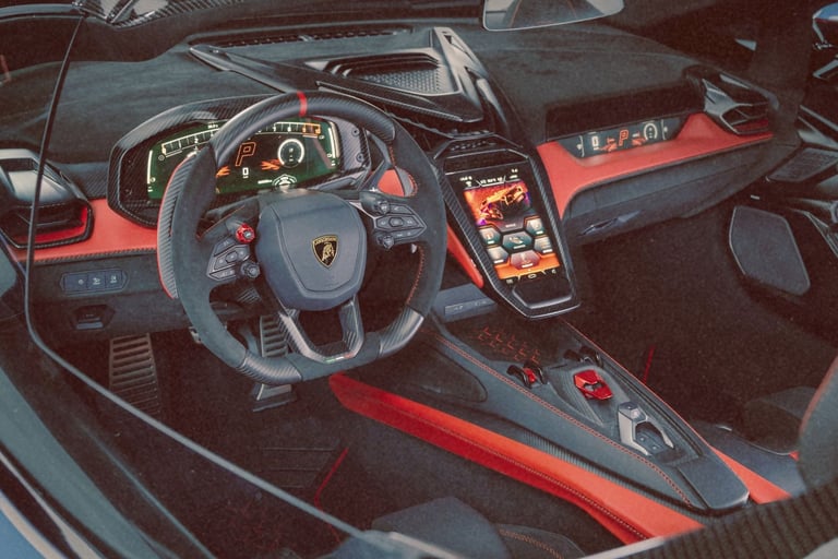 Luxury interior of a Lamborghini featuring red leather trim and digital dashboard.