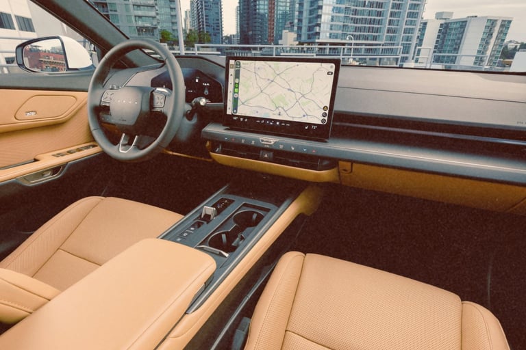 Luxury car interior with tan leather seats and a digital touchscreen navigation display.