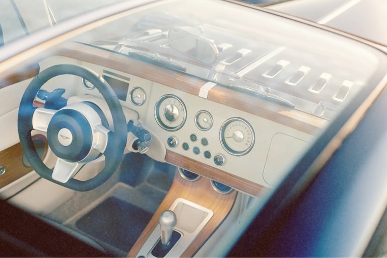Luxury vintage car interior with a wooden dashboard and classic round analog gauges.