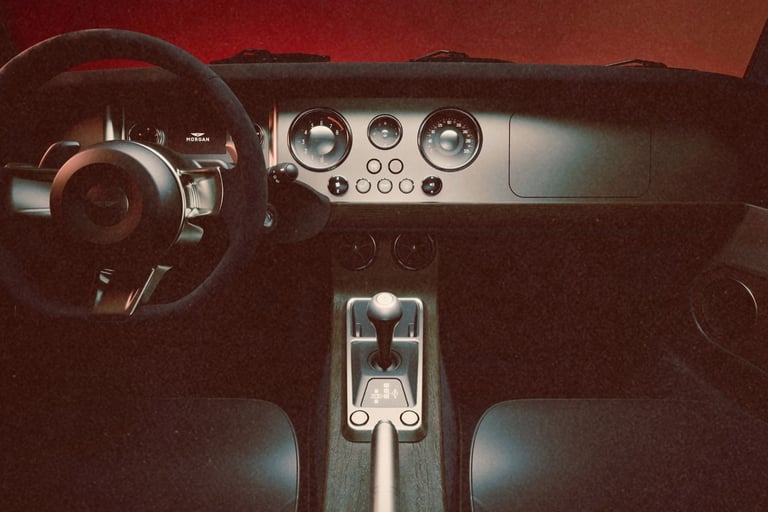Luxury Morgan sports car interior featuring a modern dashboard, analog gauges, and leather seats.