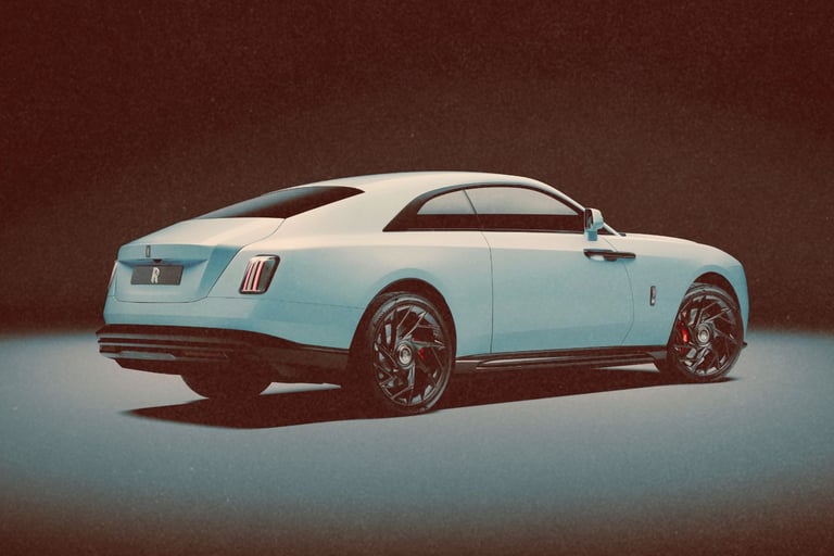 A sleek white Rolls-Royce Spectre luxury electric coupe shown from a rear three-quarter view.