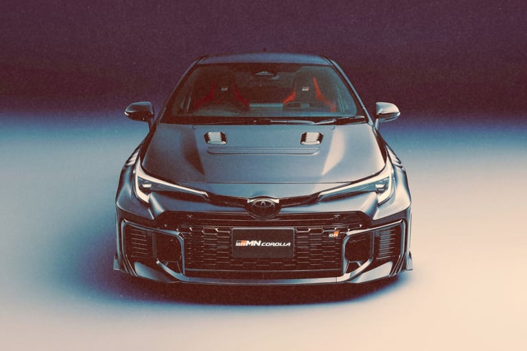 Front view of a dark grey Toyota GRMN Corolla featuring a carbon fiber hood and racing seats.