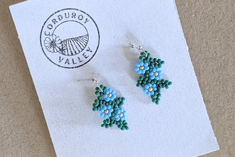 Beautifully hand beaded sky blue floral garland earrings made with Czech glass beads