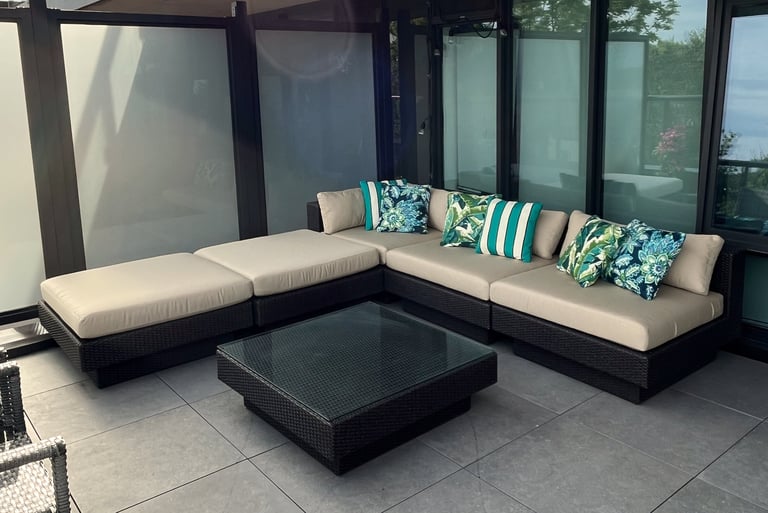 corner view of outdoor patio seating with custom cushions and pillows