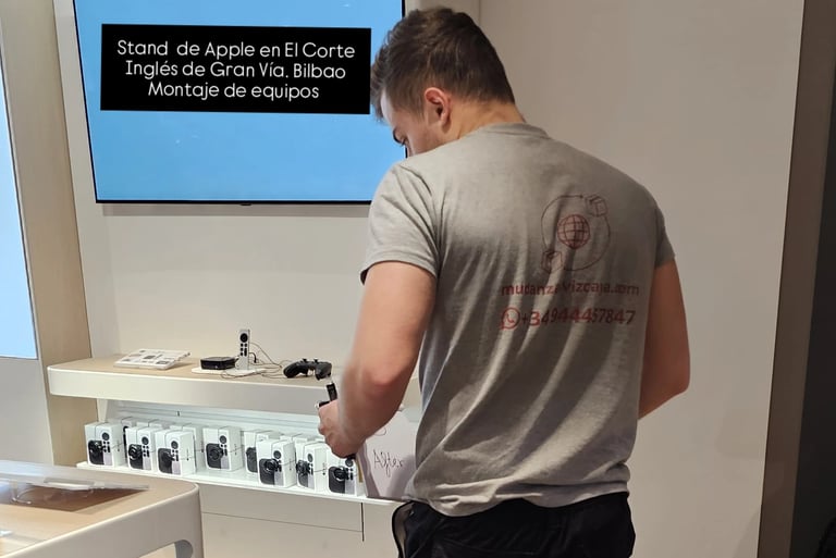 a man standing in front of a large screen