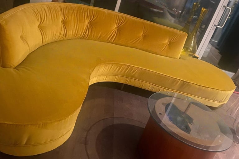  side view reupholstered boomerang sofa in gold velvet