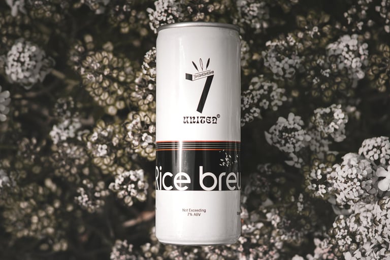 7 united rice beer in an Aluminium can with a floral backdrop