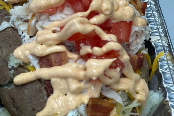 Out of this world Silly Potato! Loaded with chicken , eggs, spinach, onion, tomato, and cheese