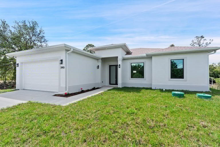 Beautifully designed front elevation of a new home for sale in Lehigh Acres, Florida."