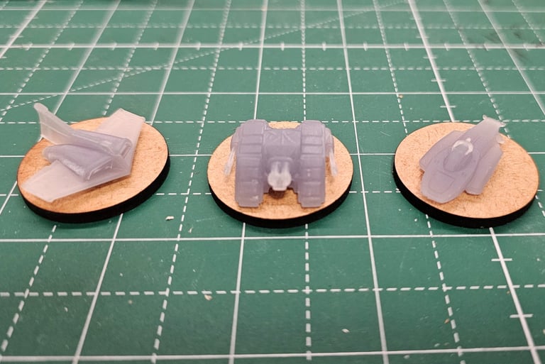 a pair of small plastic toy cars on a table