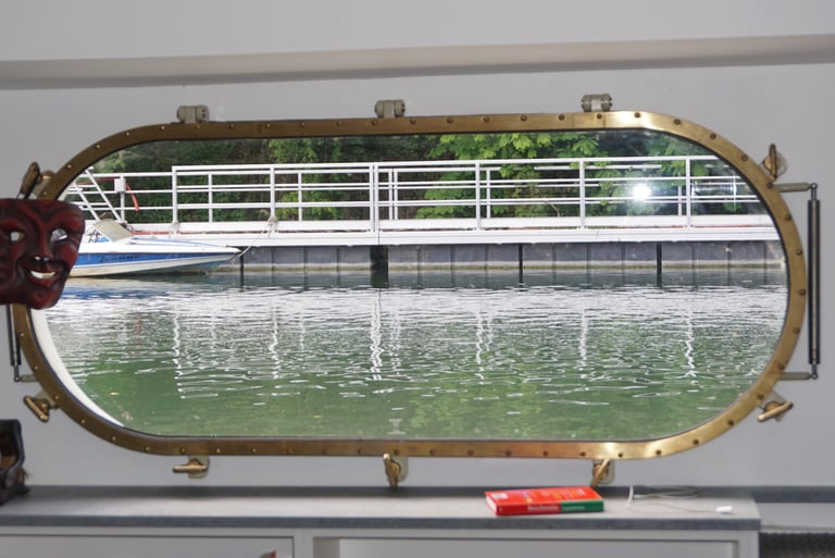 Opening oblong ship window on a dutch barge