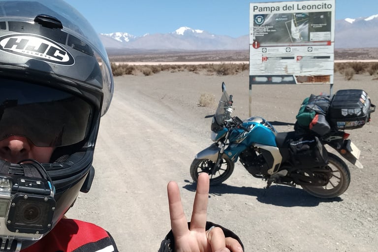 a man in a helmet and helmet on a motorcycle