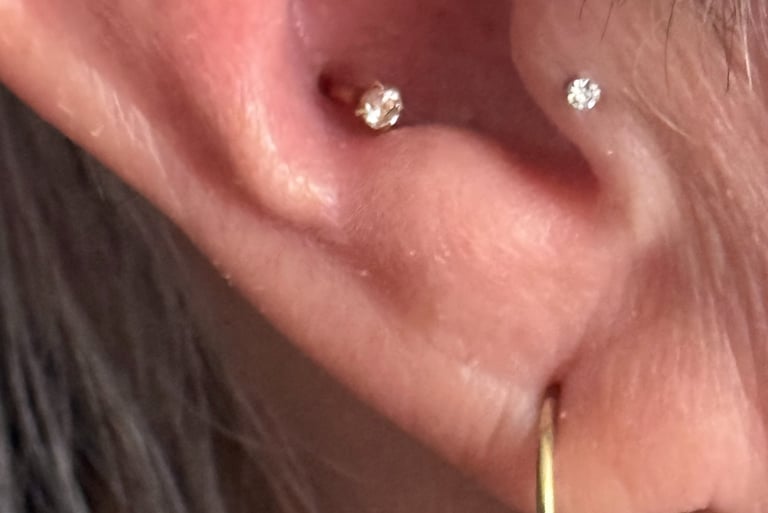 Licensed piercer giving aftercare advice in Stonehaven