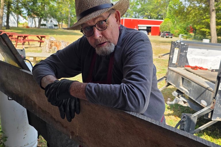 Dave McKee leaning on fence