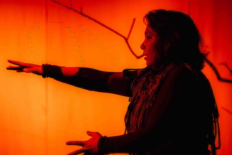 a man in a black shirt is pointing at something