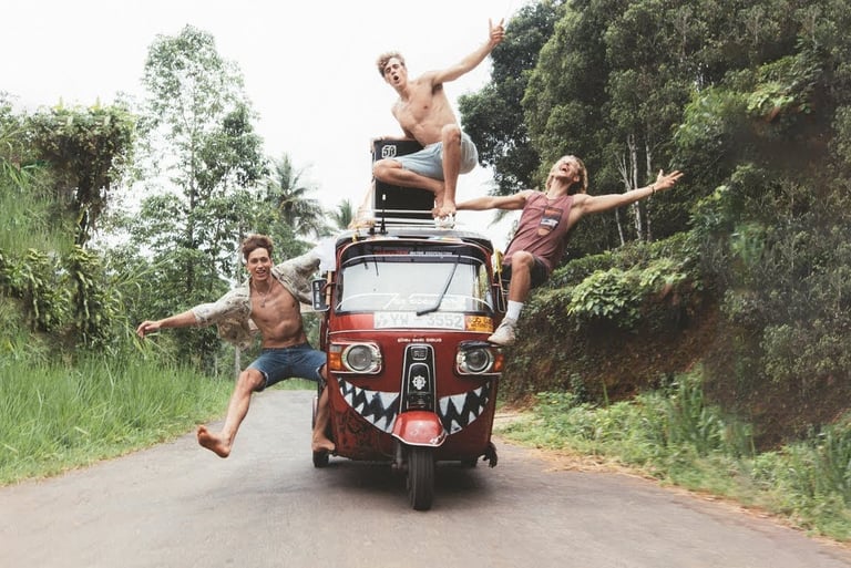 three men are riding in a tuk tuk tuk