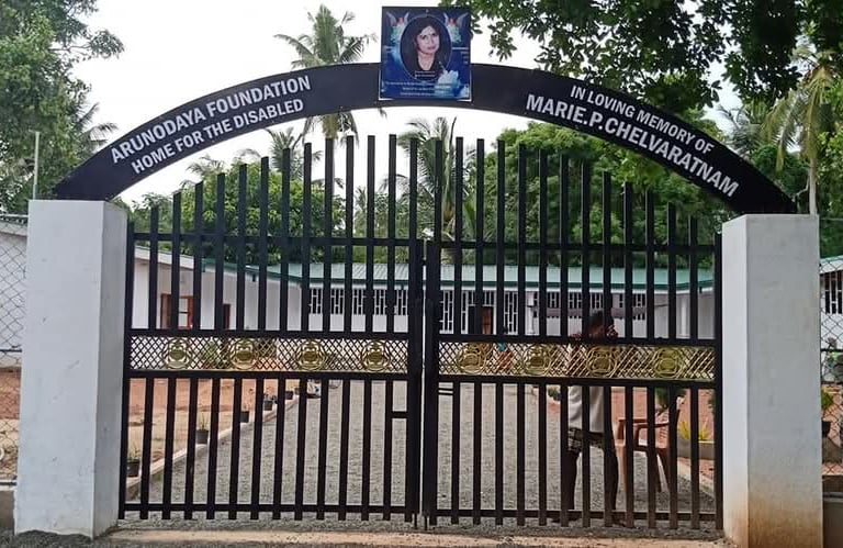 a gated entrance to a building with a sign that says,'welcome to