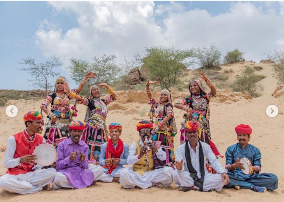 a group of people in traditional indian clothing