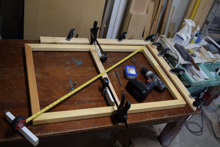 Installing custom cross-braces for a stretched canvas.