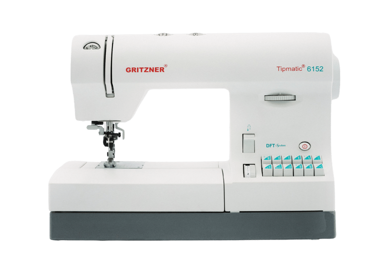 a sewing machine with a white sewing machine