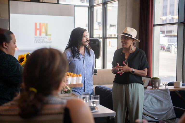 Tito Sandigo and Monica Muñoz Andry speak passionately at a Hispanic Austin Leadership meeting.