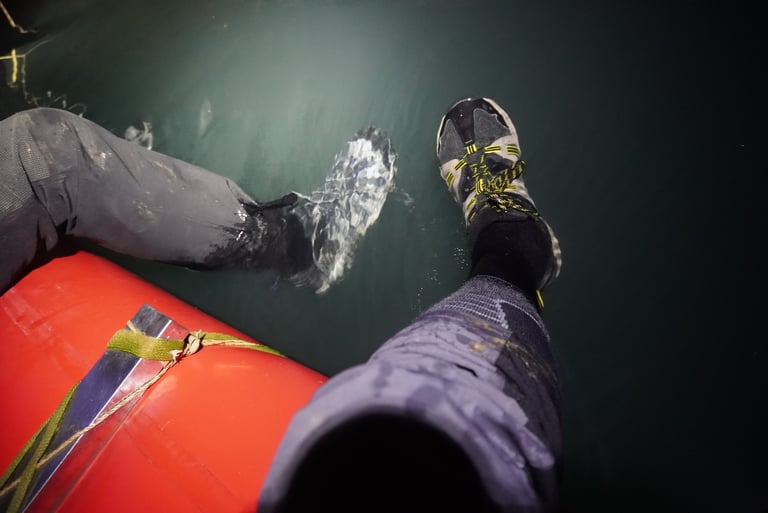 getting our shoes cleaned on rafts in passchendaele in hang son doong cave, vietnam