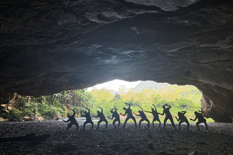kitting up in the entrance to hang en cave, Ke Bang national park, Vietnam