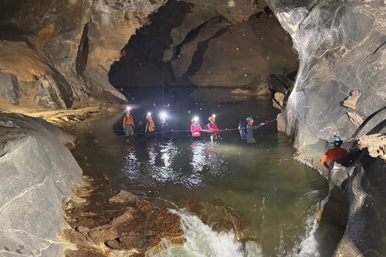Path leading down to a river crossing in Hang Son Doong Cave, Ke Bang National Park, Vietnam