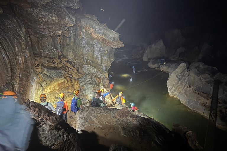 Path leading down to a river crossing in Hang Son Doong Cave, Ke Bang National Park, Vietnam