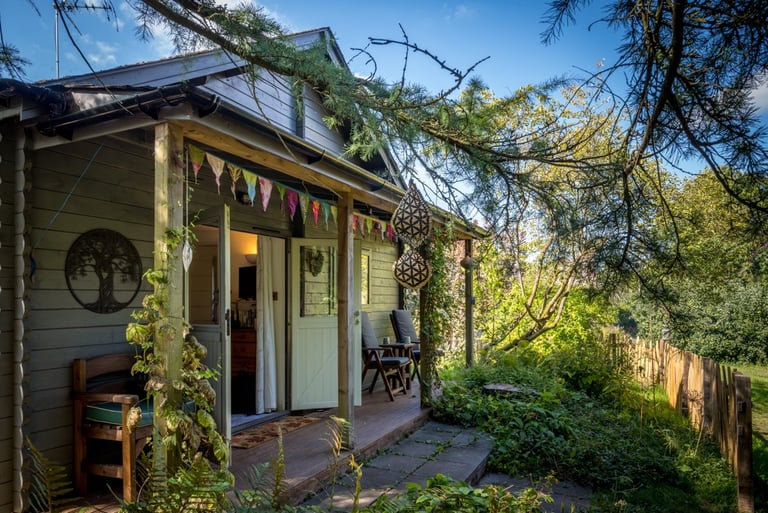 a house with a porch and a wooden deck