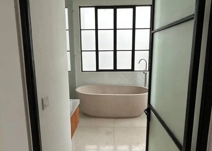 terrazzo bathroom in Balinese villa with natural stone and outdoor view
