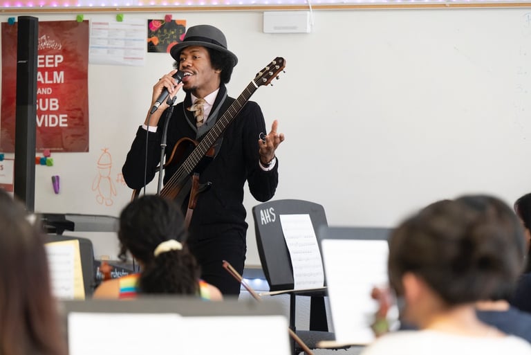 artist Christylez Bacon leads orchestra students in a workshop (credit: Joyce Naltchayan Boghosian)