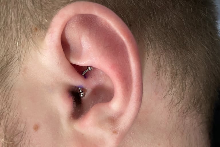 	Safe daith piercing with titanium hoop in Montrose