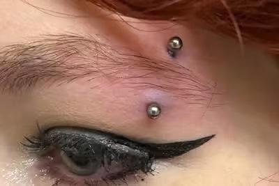 Eyebrow piercing the plain curved barbell