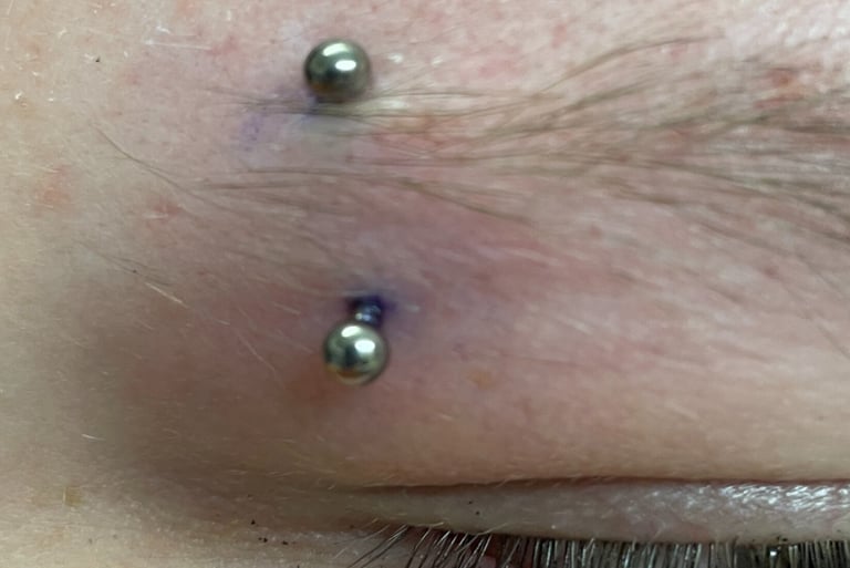 Titanium curved barbell for eyebrow piercing in Stonehaven