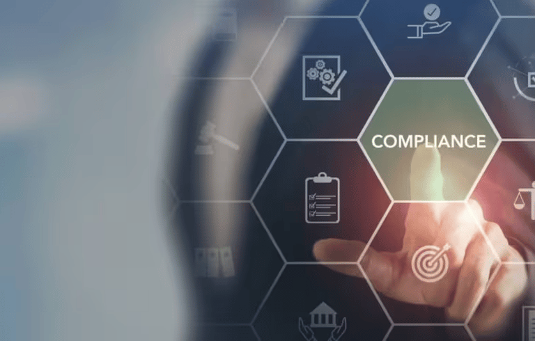 a business man holding a tablet with the word compliance