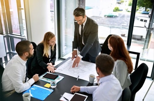 a group of business people working on a project