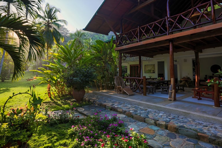 a hotel with a stone patio in villavicencio